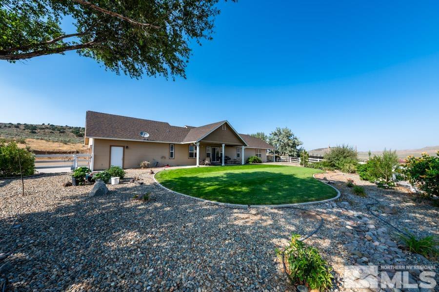 200 Antelope Valley Road Reno, NV 89506 - Photo 22 of 28 a front view of a house with a yard and garage