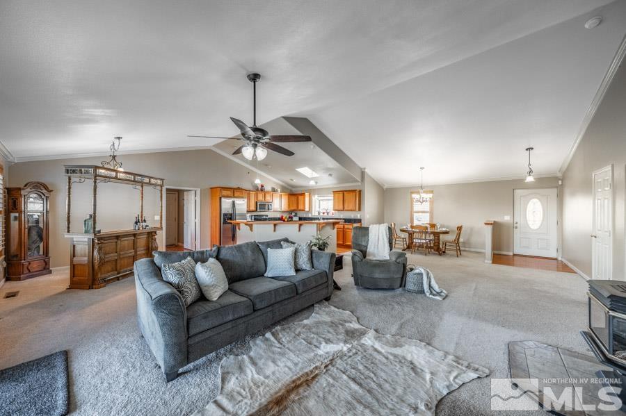 200 Antelope Valley Road Reno, NV 89506 - Photo 9 of 28 a living room with furniture and a chandelier