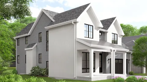 a view of a white house next to a yard