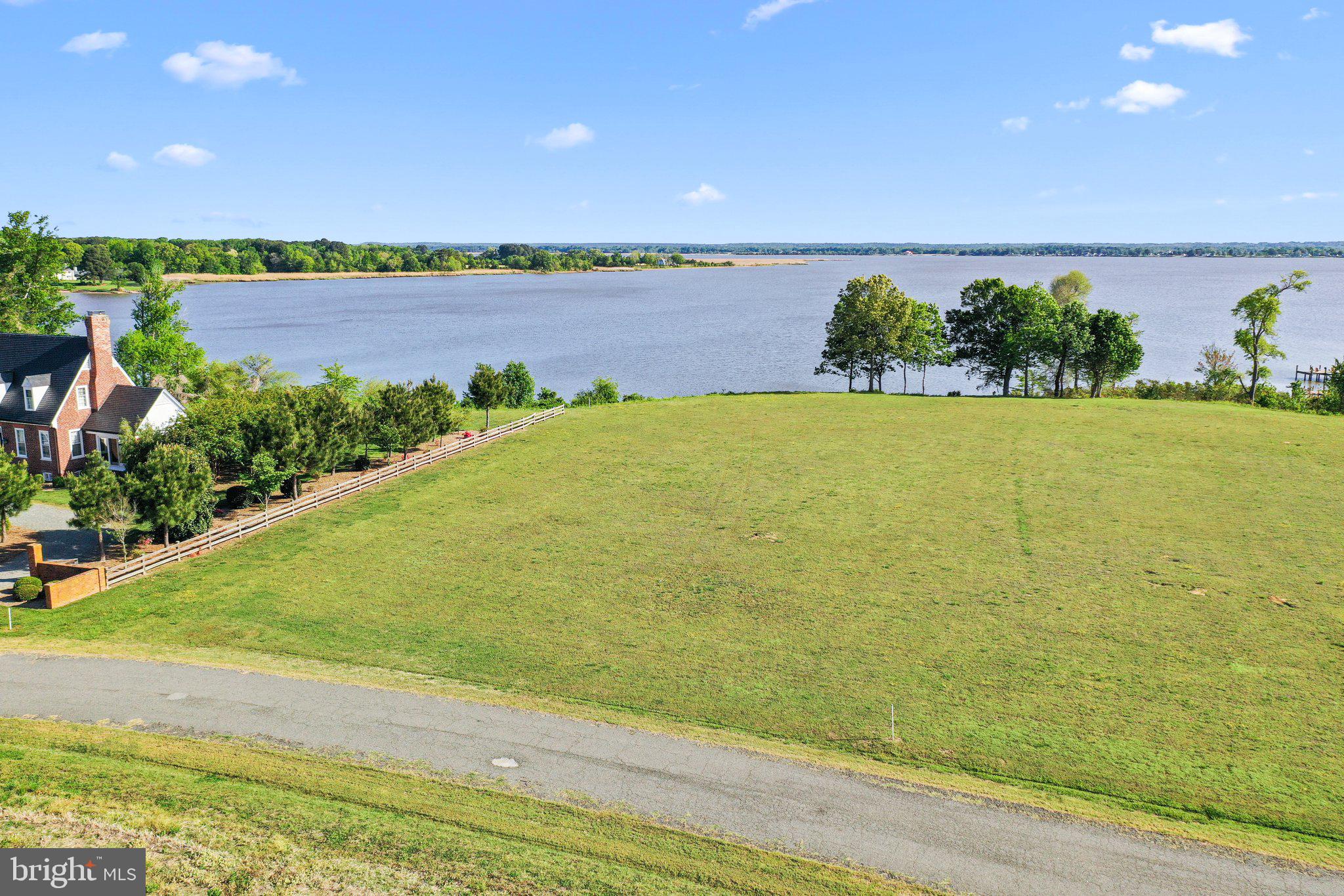 Lot D Benton Point Road Tappahannock, VA 22560 - Photo 2 of 7 a view of a lake and a yard