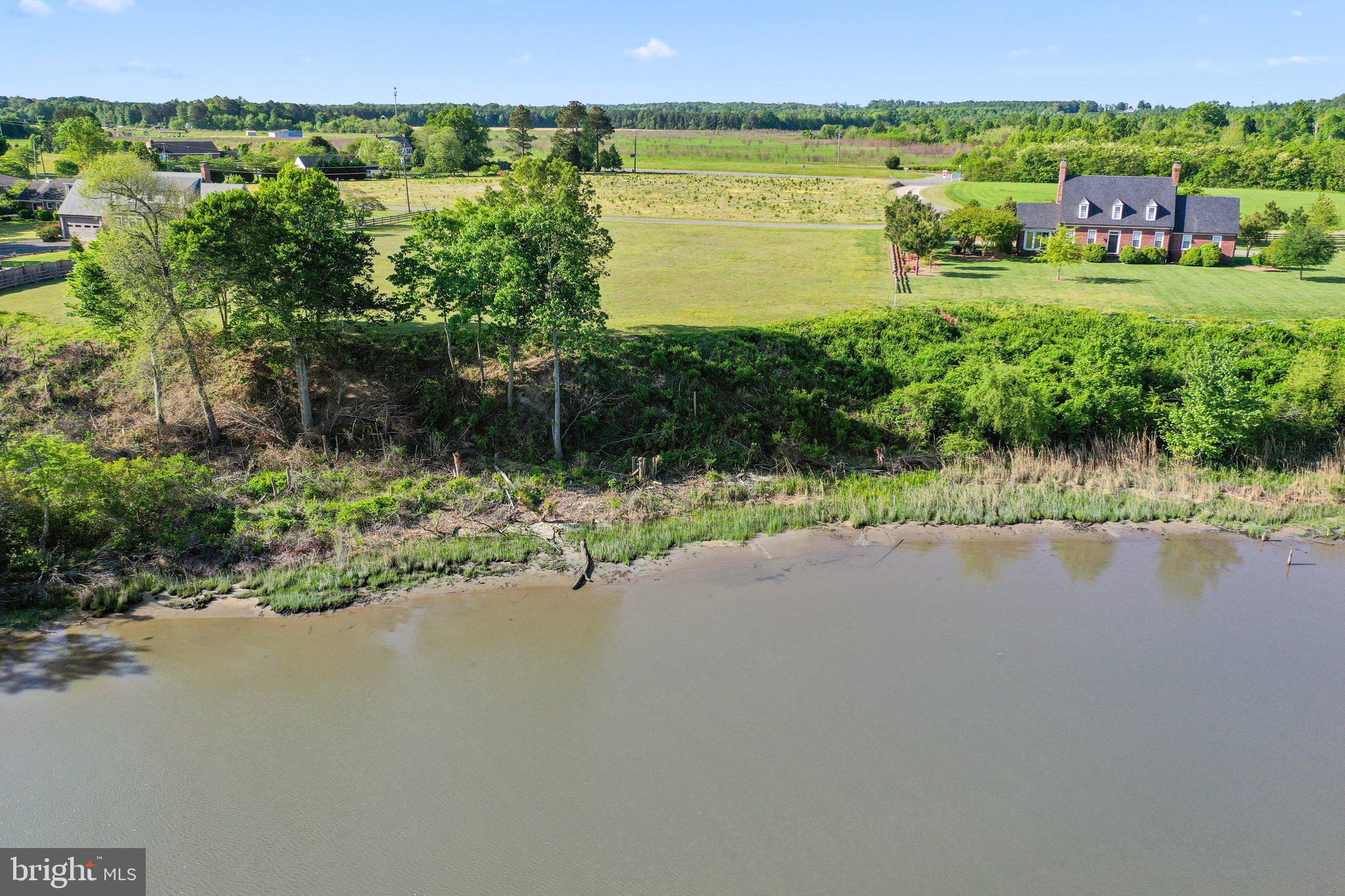 Lot D Benton Point Road Tappahannock, VA 22560 - Photo 3 of 7 a view of a lake with a yard