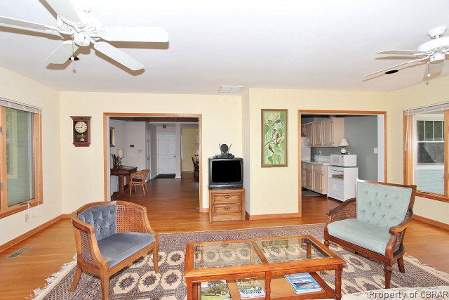 80 Deer Run Road Lancaster, VA 22503 - Photo 11 of 32 a living room with furniture and a flat screen tv