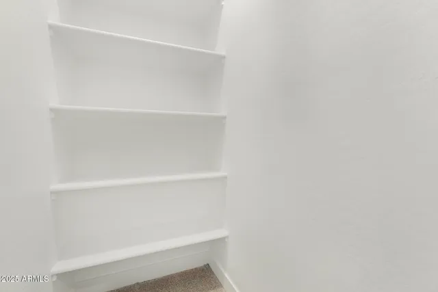 a kitchen with a sink stainless steel appliances and cabinets