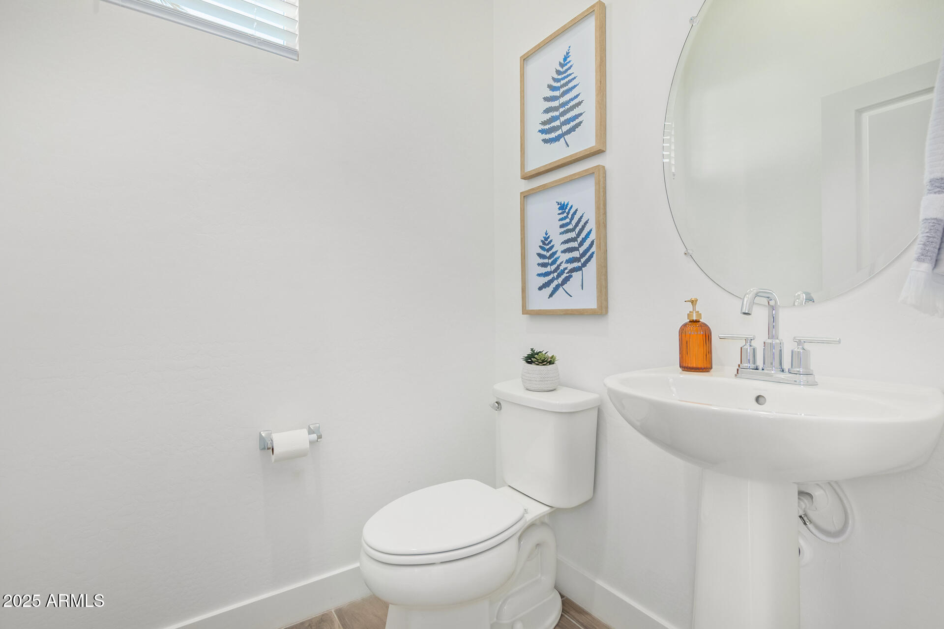 3230 East Thomas Road, Unit 112 Mesa, AZ 85213 - Photo 12 of 32 a bathroom with a toilet sink and mirror