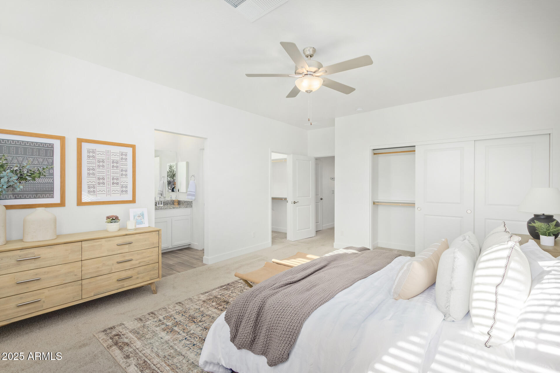 3230 East Thomas Road, Unit 112 Mesa, AZ 85213 - Photo 15 of 32 a bedroom with a bed and a chandelier