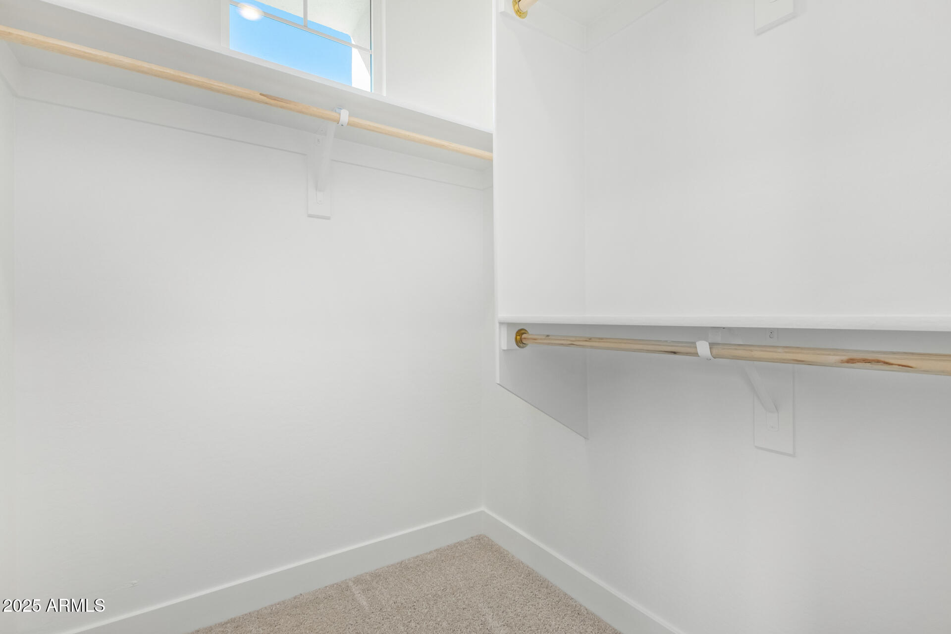 3230 East Thomas Road, Unit 112 Mesa, AZ 85213 - Photo 18 of 32 a view of a room with racks on the wall