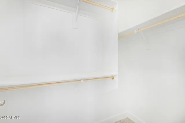 a view of a room with racks on the wall