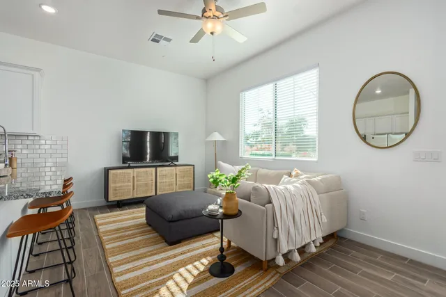 a living room with furniture and a large window