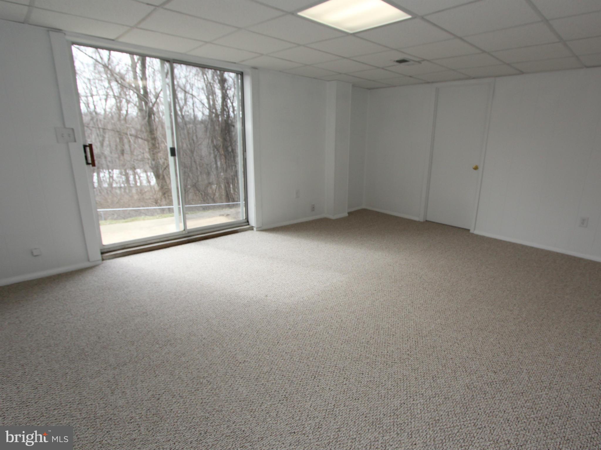 5047 Shookstown Road Frederick, MD 21702 - Photo 16 of 30 an empty room with an outdoor view and a window