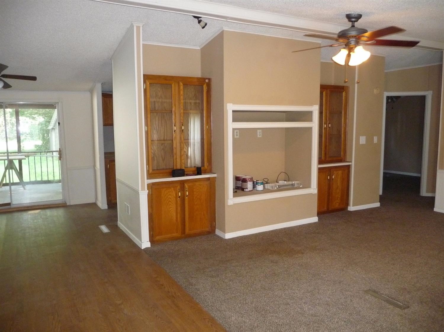 11889 Old Colony Road Demotte, IN 46310 - Photo 5 of 10 a view of an empty room with window and a kitchen