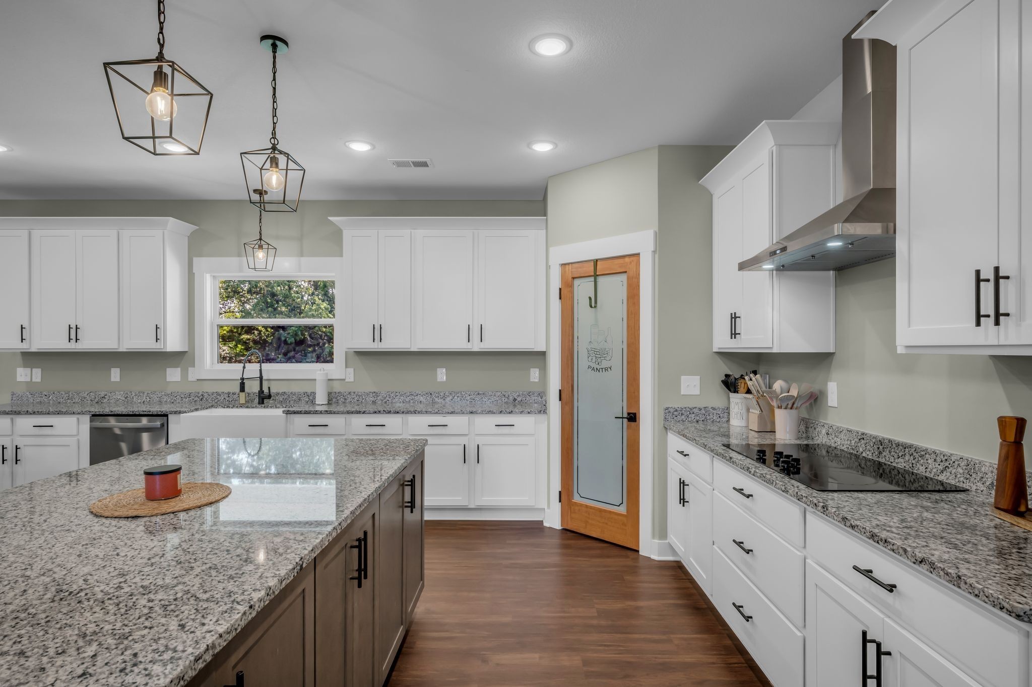 454 Gum Branch Road Burns, TN 37029 - Photo 16 of 27 a kitchen with granite countertop a sink a counter space appliances and cabinets