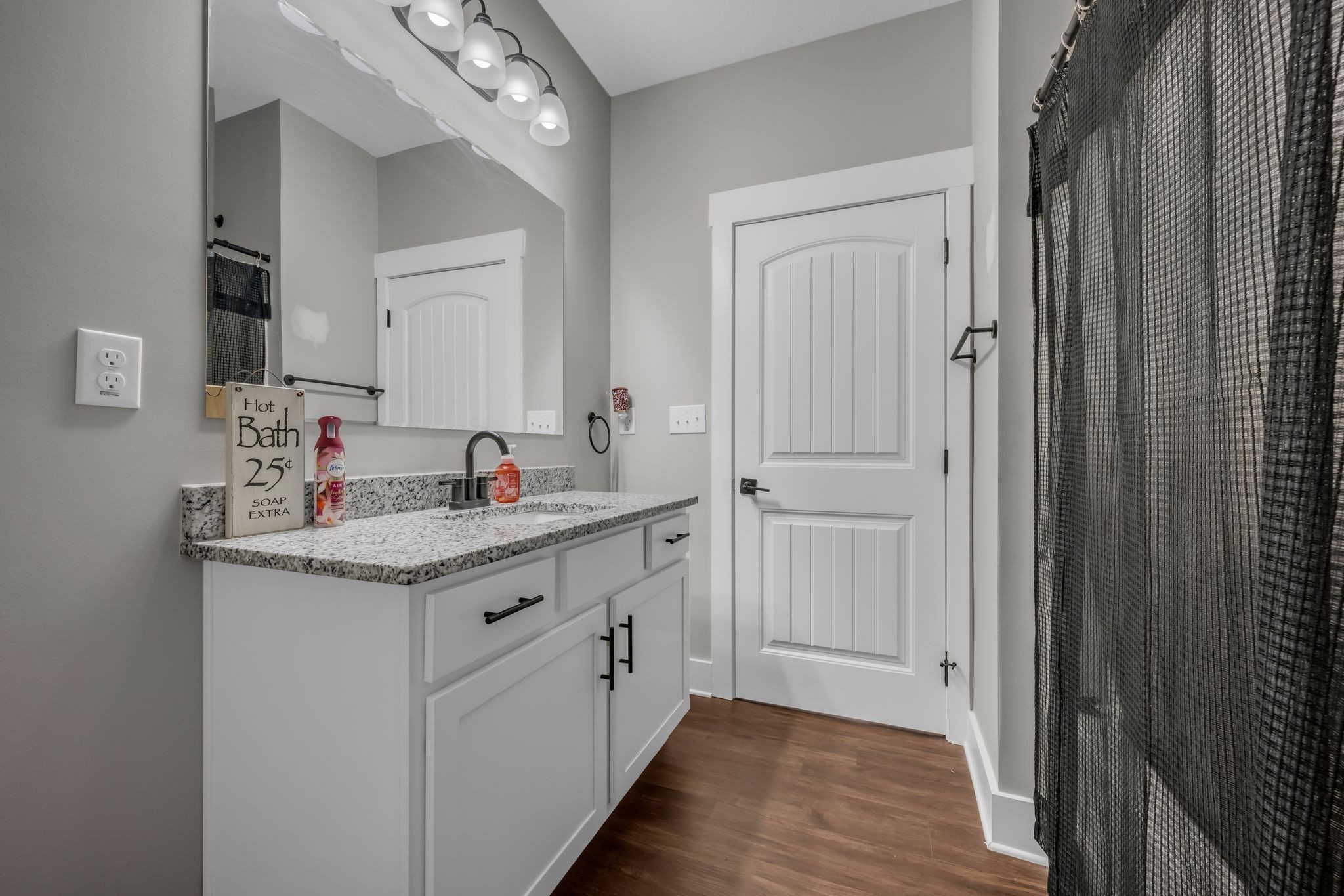 454 Gum Branch Road Burns, TN 37029 - Photo 21 of 27 a bathroom with a granite countertop sink and a mirror