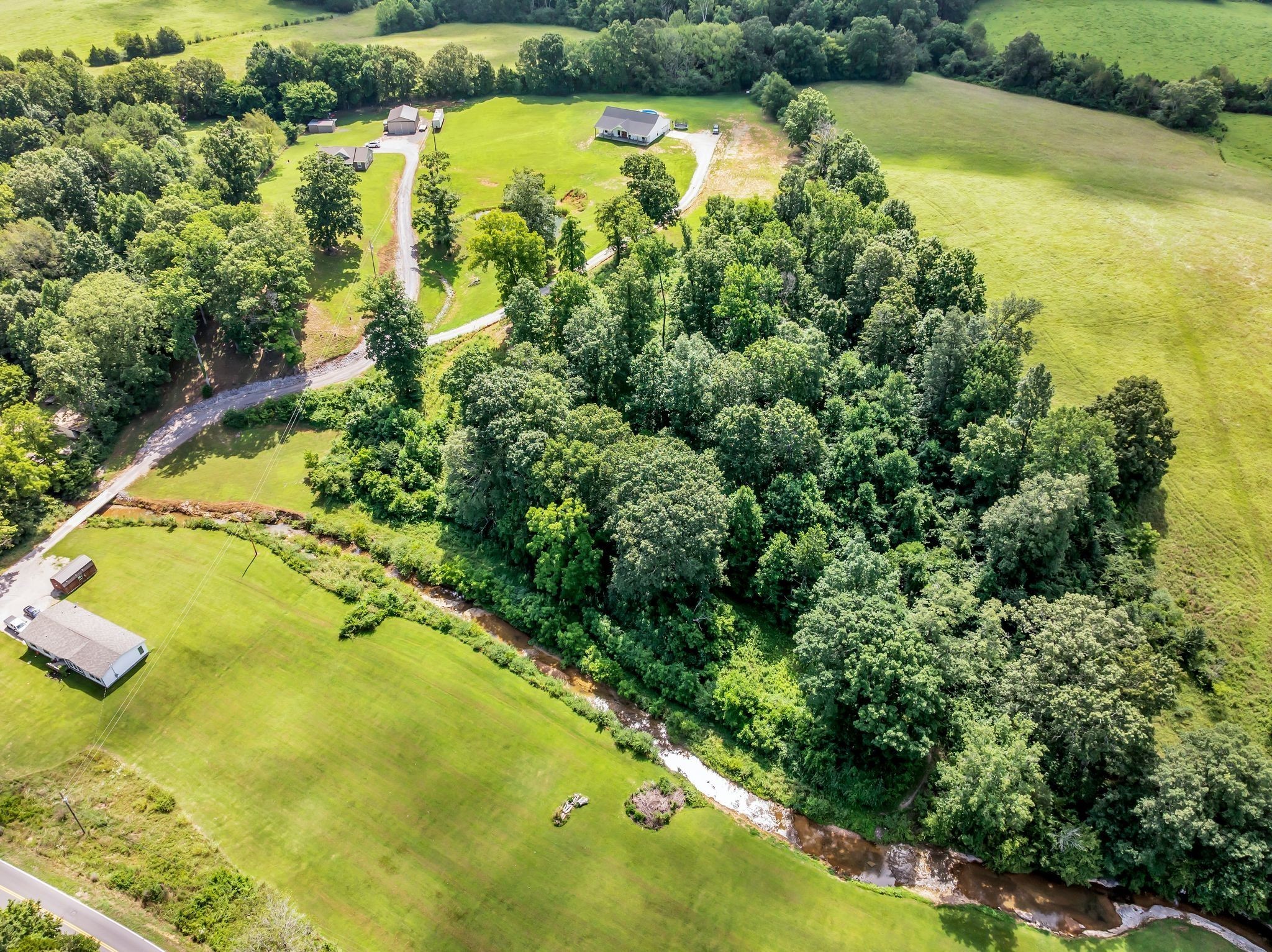 454 Gum Branch Road Burns, TN 37029 - Photo 5 of 27 a view of a lake with a yard