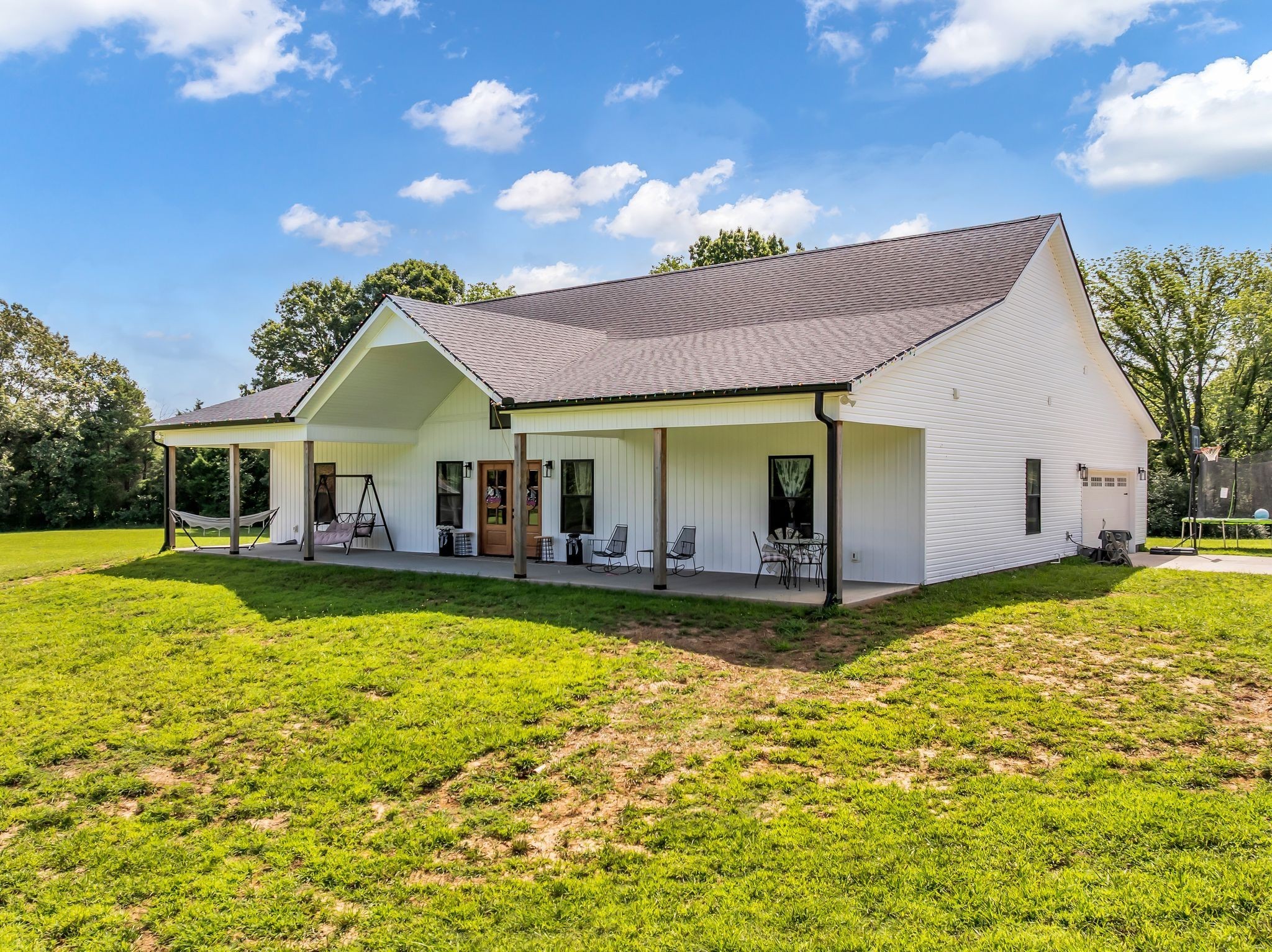 454 Gum Branch Road Burns, TN 37029 - Photo 7 of 27 a view of a house with swimming pool and a yard