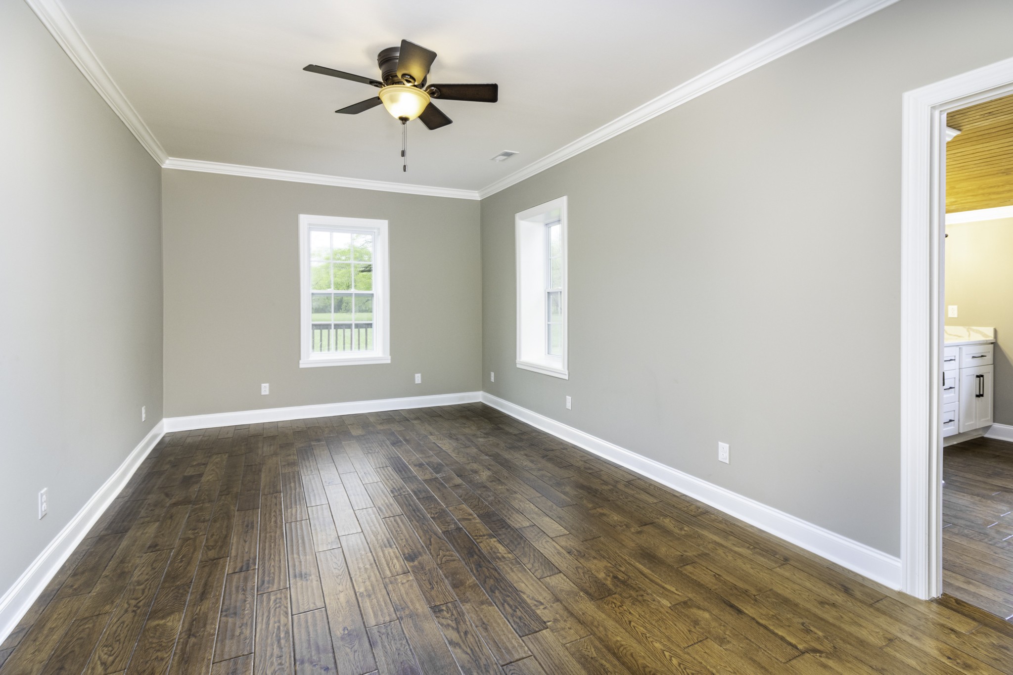 4768 Stella Road Prospect, TN 38477 - Photo 12 of 33 an empty room with wooden floor and windows