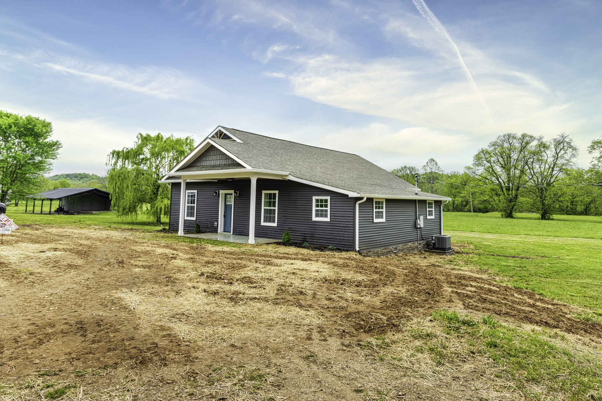 4768 Stella Road Prospect, TN 38477 - Photo 15 of 33 a front view of a house with yard and tree