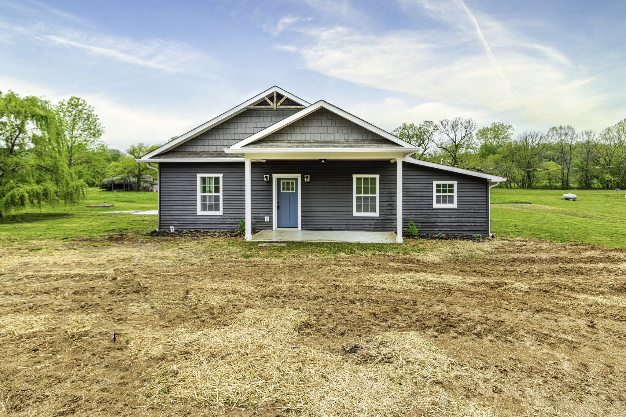 4768 Stella Road Prospect, TN 38477 - Photo 2 of 33 a view of a house with a yard