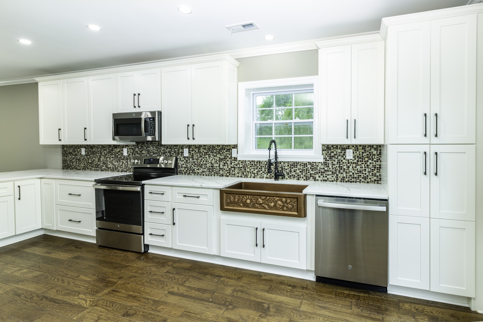 4768 Stella Road Prospect, TN 38477 - Photo 6 of 33 a kitchen with stainless steel appliances granite countertop a stove a sink and a refrigerator