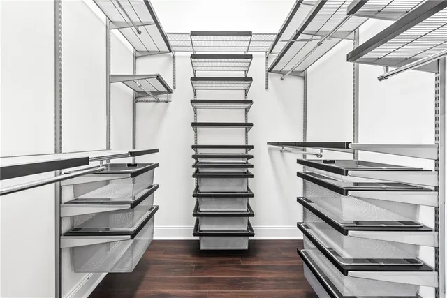 a view of a room with gym equipment and a large window