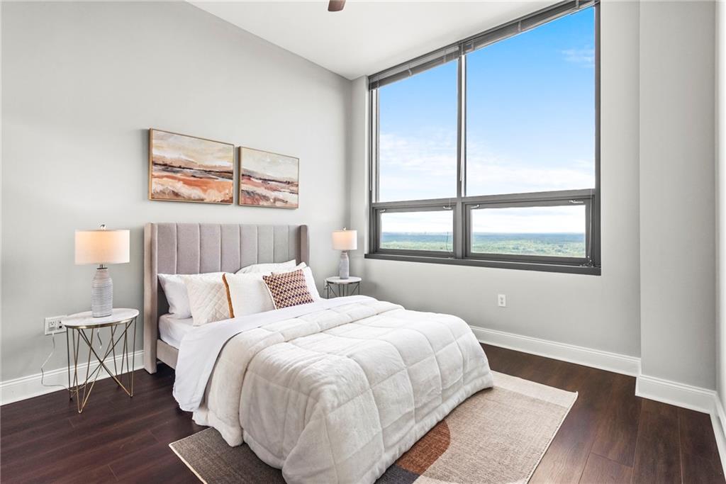 270 17th Street Northwest, Unit 4306 Atlanta, GA 30363 - Photo 23 of 54 a bedroom with a bed and a window