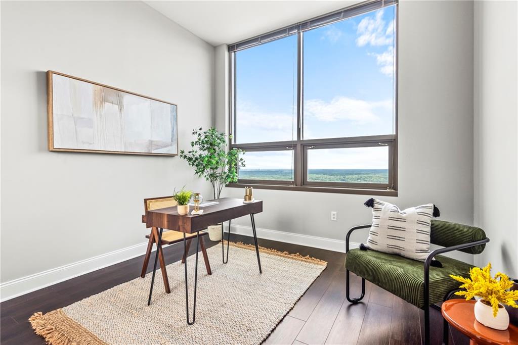 270 17th Street Northwest, Unit 4306 Atlanta, GA 30363 - Photo 26 of 54 a living room with furniture and a window