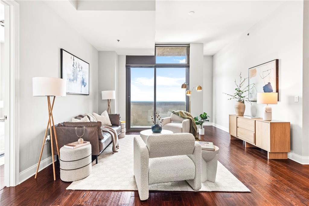 270 17th Street Northwest, Unit 4306 Atlanta, GA 30363 - Photo 5 of 54 a living room with furniture and a large window