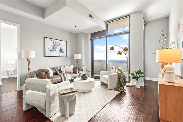 a kitchen with granite countertop stainless steel appliances a stove a sink and a microwave