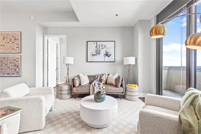 a bedroom with a bed lamp and window