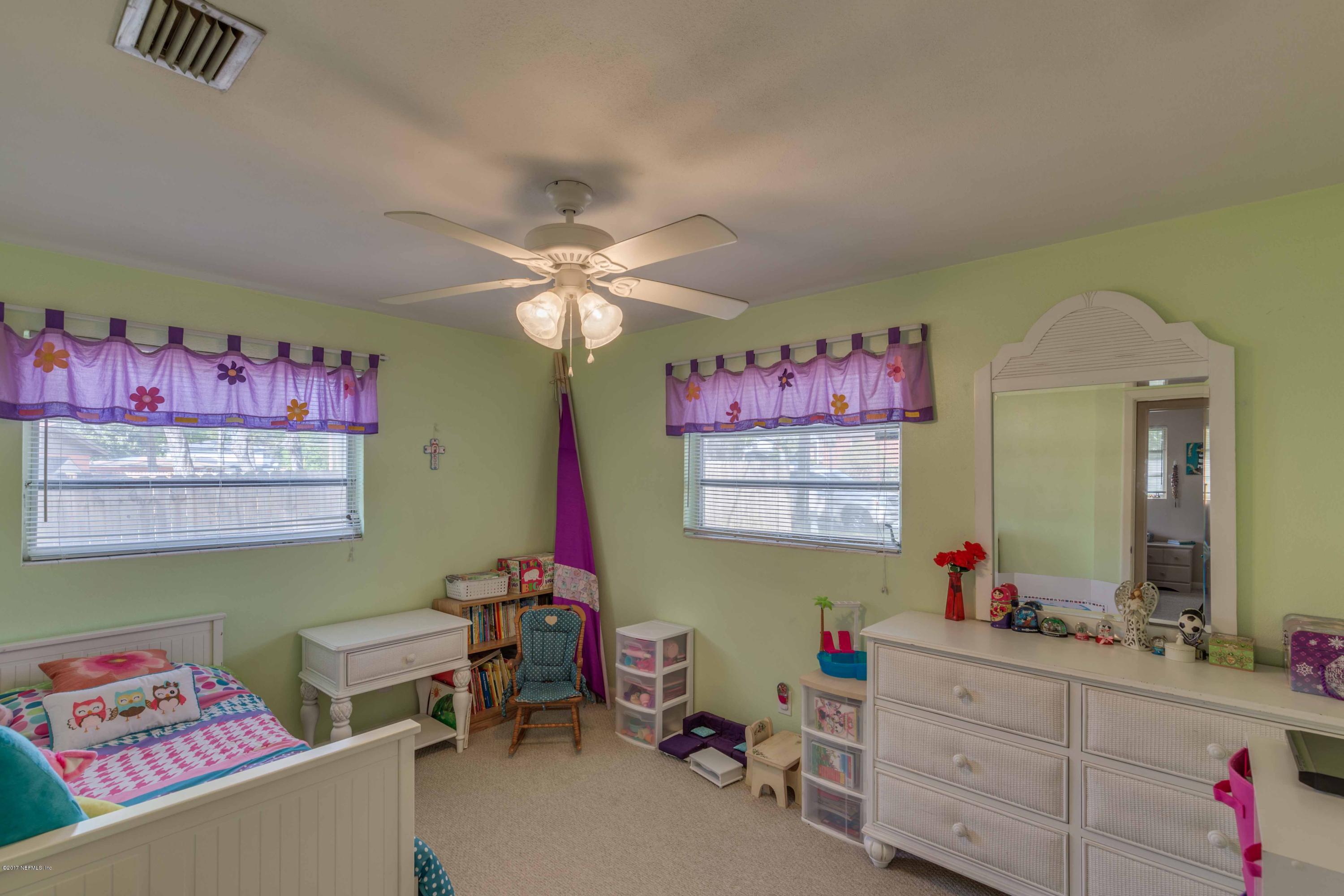 4020 Rogero Road Jacksonville, FL 32277 - Photo 15 of 23 a room with furniture and a wooden floor