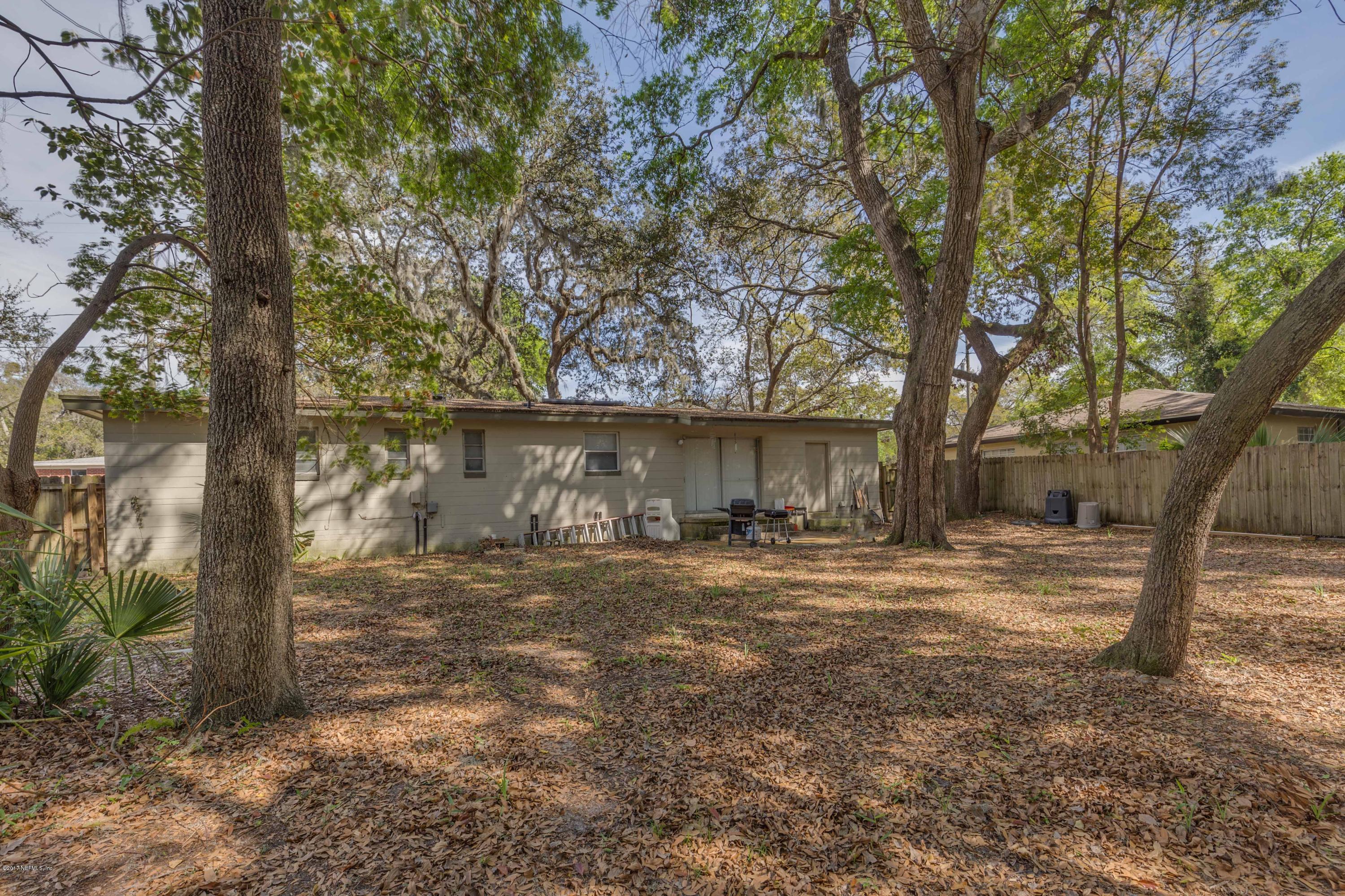 4020 Rogero Road Jacksonville, FL 32277 - Photo 23 of 23 a view of a yard with large tree