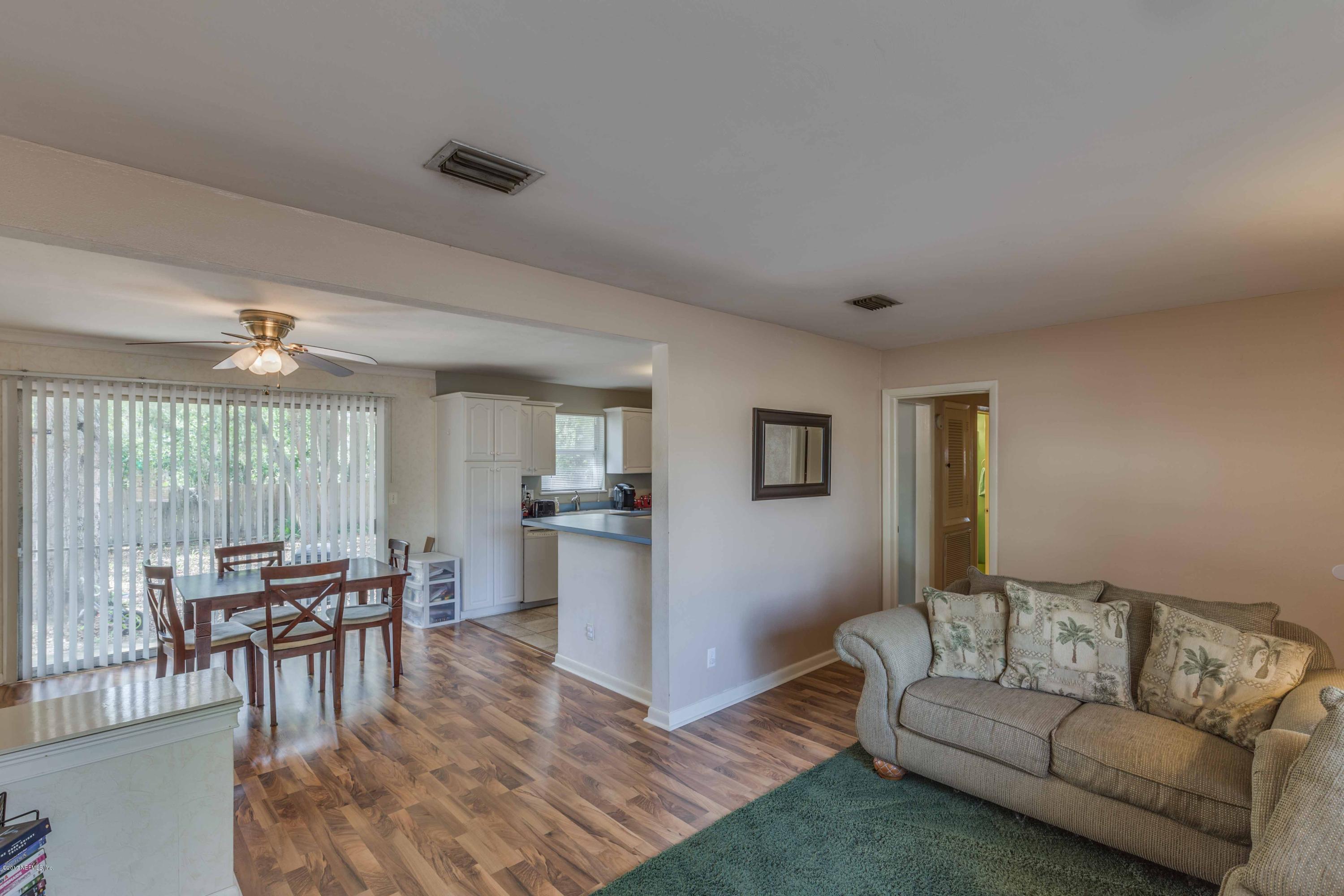 4020 Rogero Road Jacksonville, FL 32277 - Photo 6 of 23 a living room with furniture and a table