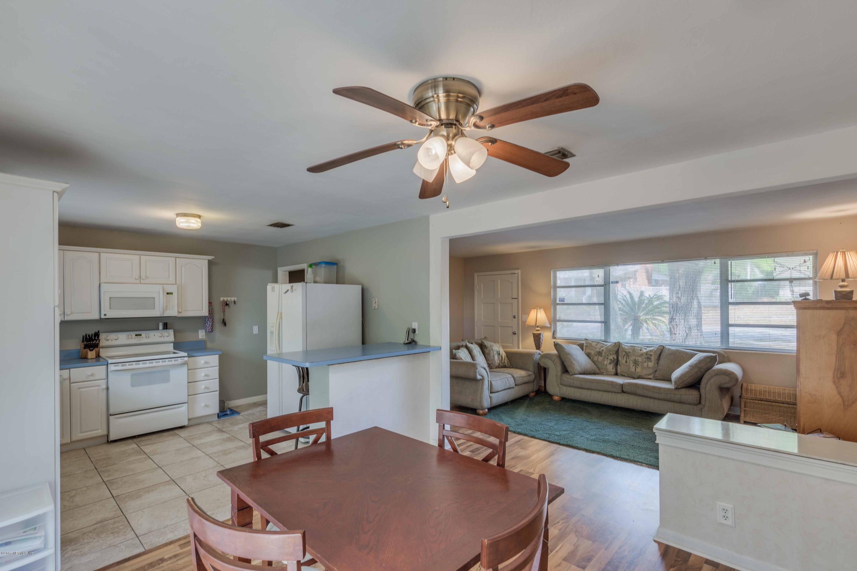 4020 Rogero Road Jacksonville, FL 32277 - Photo 8 of 23 a living room with furniture and a large window