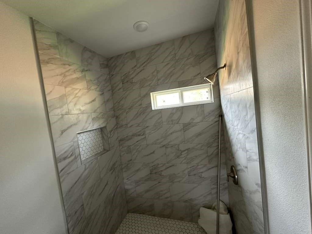 1307 West 33rd Street Tyler, TX 75702 - Photo 7 of 11 a bathroom with a shower