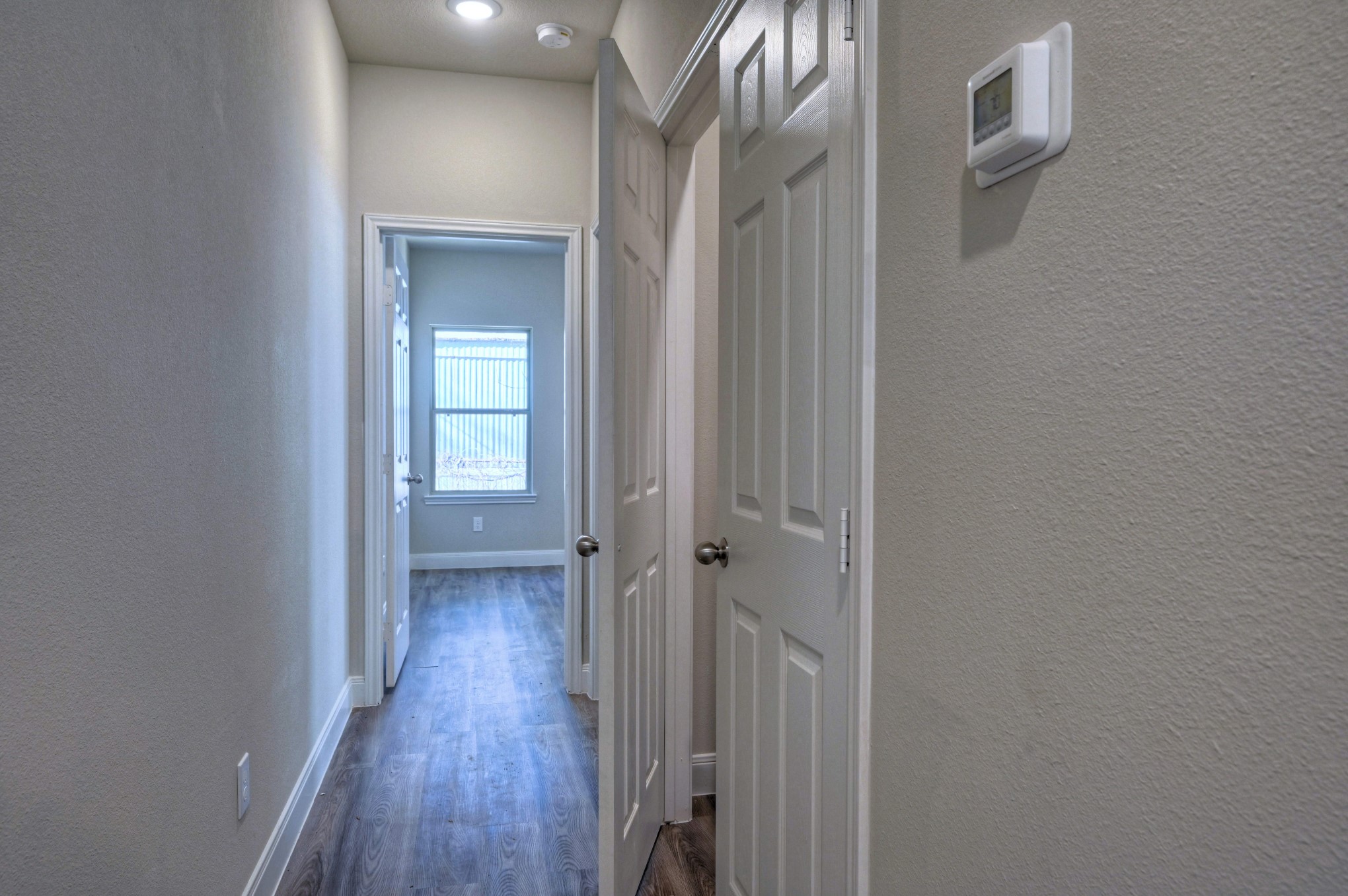 9173 Inwood Willis, TX 77318 - Photo 13 of 31 a view of a hallway with wooden floor