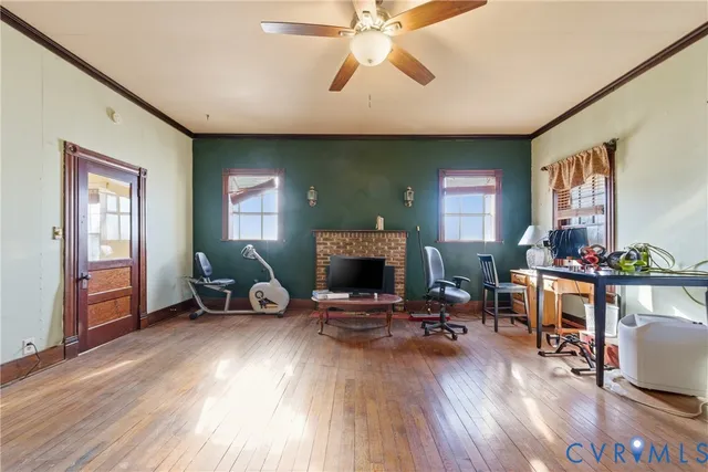 a view of a livingroom with furniture and a flat screen tv