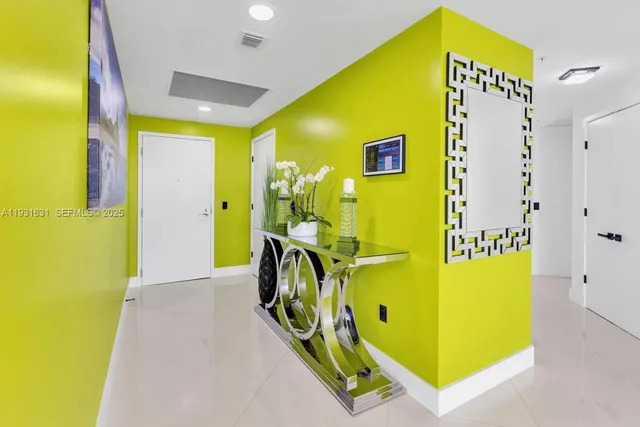 a large white kitchen with a large window