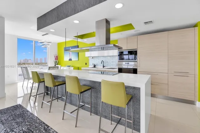 a large white kitchen with a large window