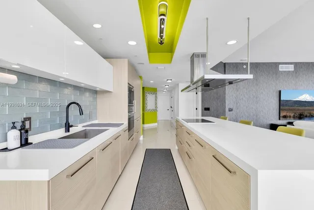 a view of a dining room with furniture and a potted plant