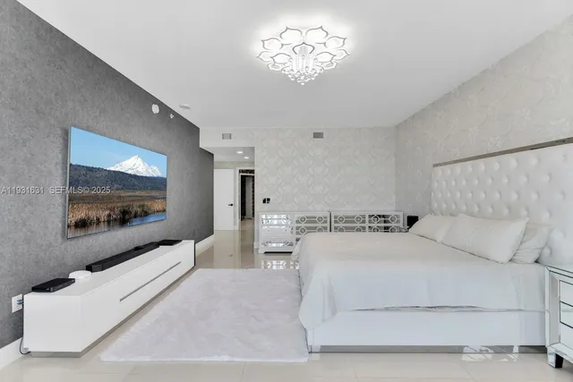 a bathroom with a tub a sink and a large mirror