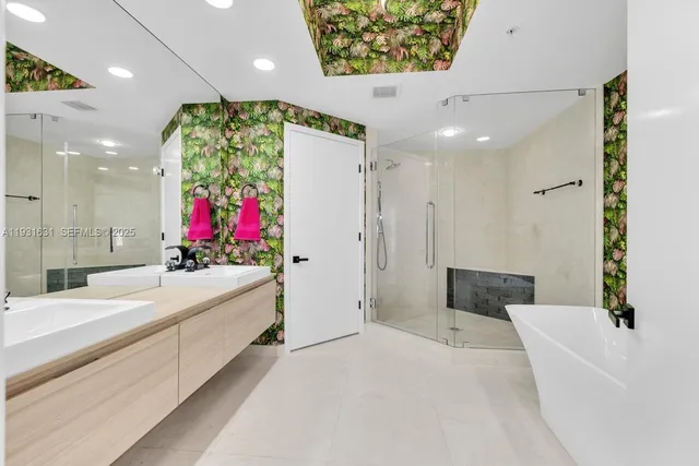 a bathroom with a sink mirror and vanity