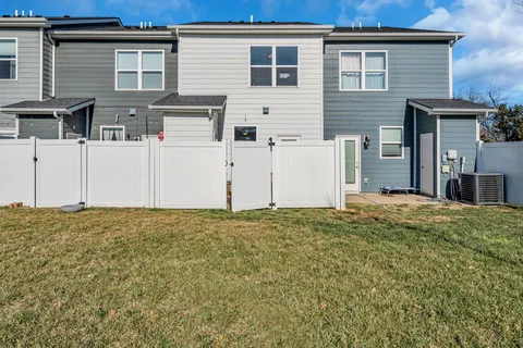 a backyard of a white house