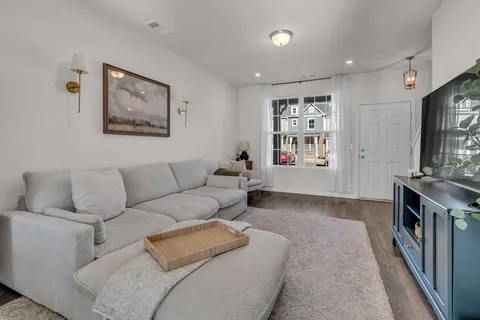 a kitchen with stainless steel appliances granite countertop white cabinets stove a sink and dishwasher