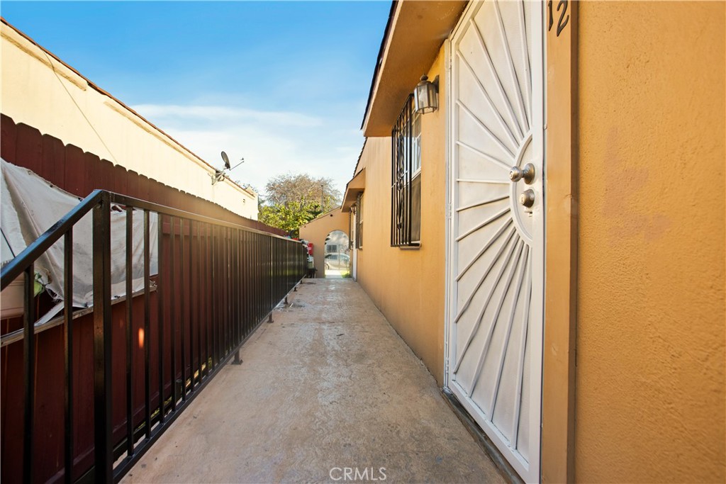 8449 Main Street Los Angeles, CA 90003 - Photo 4 of 17 a view of a balcony with wooden floor