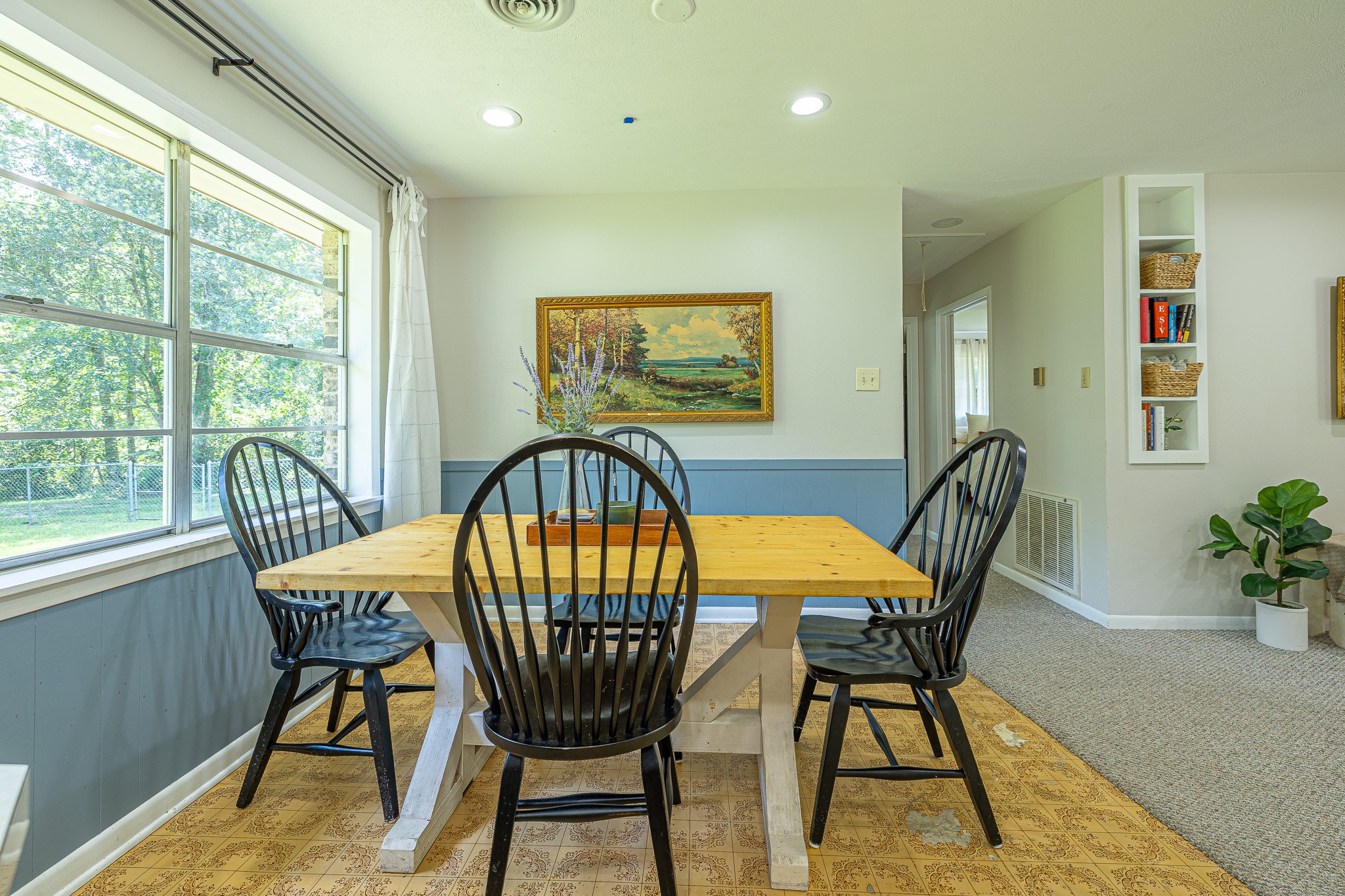 1009 Fish Hatchery Road Huntsville, TX 77320 - Photo 9 of 16 a view of a dining room with furniture and a window