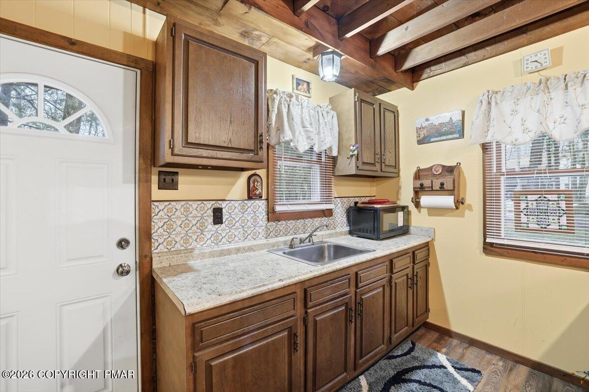 47 Red Wing Path Gouldsboro, PA 18424 - Photo 24 of 51 a kitchen with stainless steel appliances granite countertop a sink and dishwasher a refrigerator with wooden cabinets
