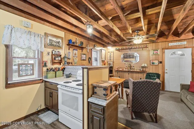 a kitchen with a sink and refrigerator