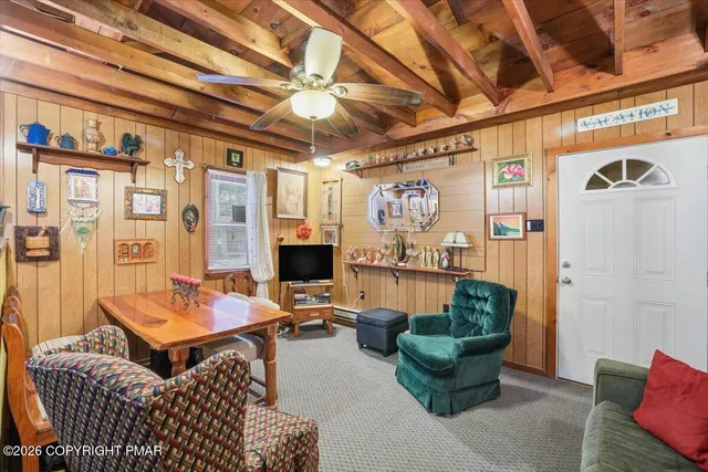 a room with furniture and a flat screen tv