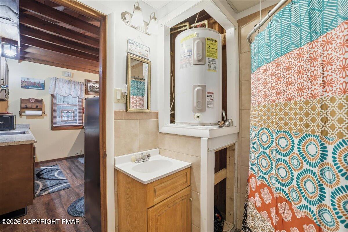 47 Red Wing Path Gouldsboro, PA 18424 - Photo 33 of 51 a bathroom with a sink and a mirror