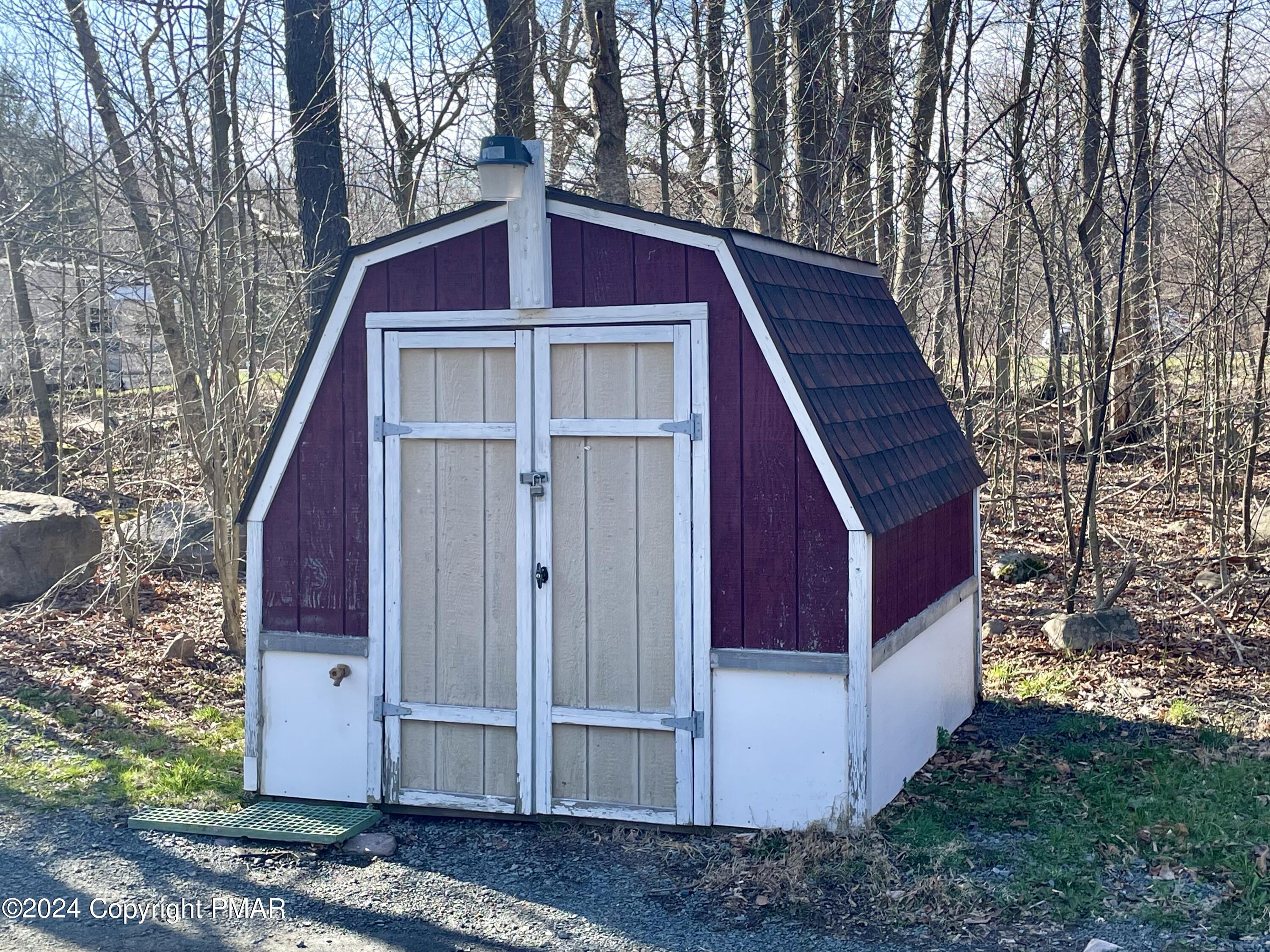 47 Red Wing Path Gouldsboro, PA 18424 - Photo 40 of 51 a view of a wooden house with a small yard and large trees