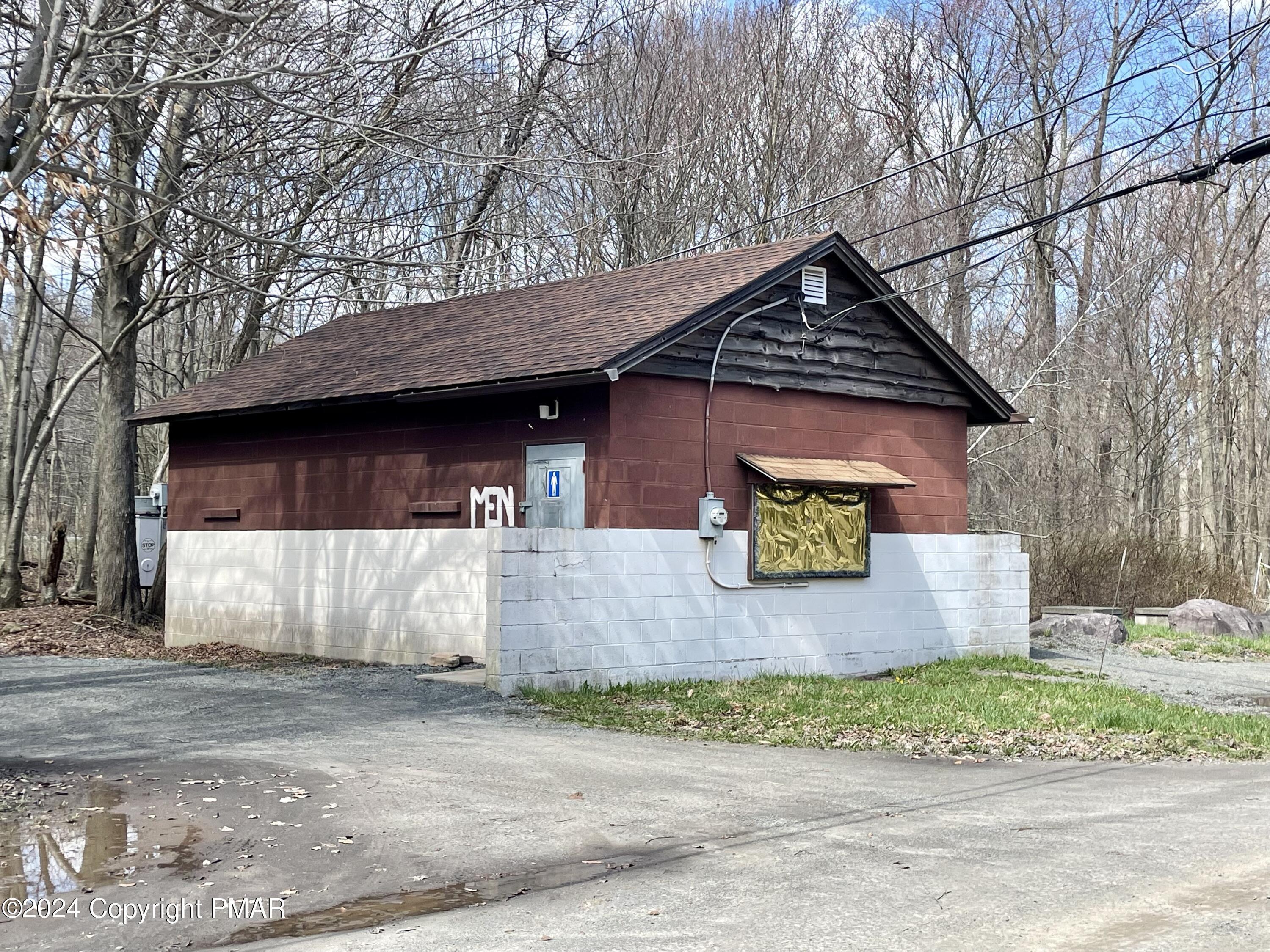 47 Red Wing Path Gouldsboro, PA 18424 - Photo 42 of 51 a front view of a house with a yard and garage